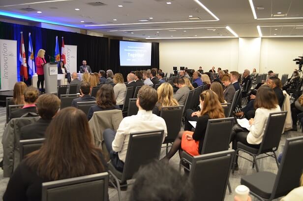 photo of a group of people at a media announcement event in Halifax