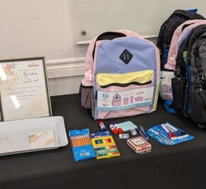 school supplies donation activation. giving back. anniversary celebration. event planning