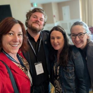 Business professionals connecting during conference break